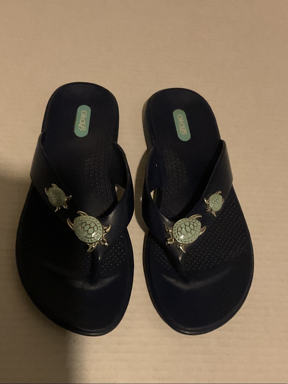OKA b. Navy Blue Flip Flop Sandals with Gold Turtle Accents